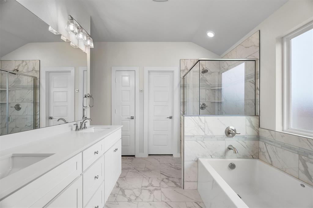 623 Kyle Drive Tioga, TX 76271 - Photo 25 of 40 a bathroom with a tub sink shower and mirror