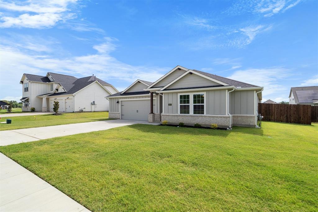 623 Kyle Drive Tioga, TX 76271 - Photo 3 of 40 a front view of a house with a big yard