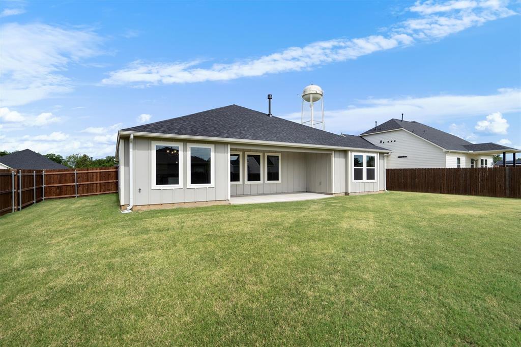 623 Kyle Drive Tioga, TX 76271 - Photo 36 of 40 a front view of a house with a garden