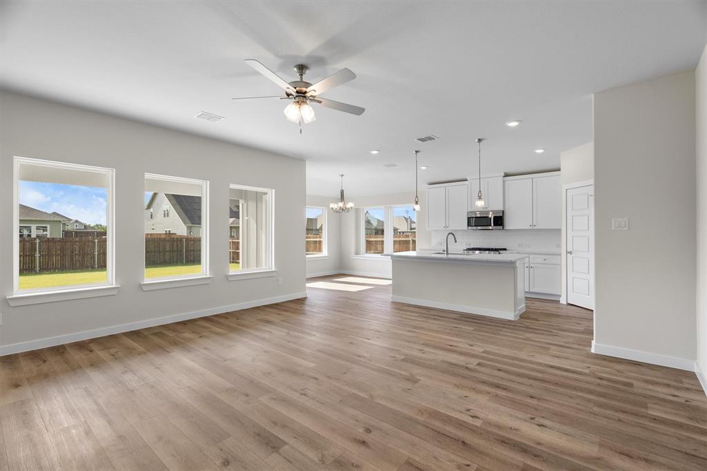 623 Kyle Drive Tioga, TX 76271 - Photo 5 of 40 a view of an empty room with kitchen and window