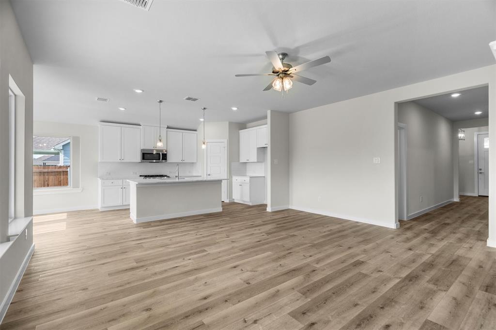 623 Kyle Drive Tioga, TX 76271 - Photo 9 of 40 a view of kitchen with granite countertop cabinets and refrigerator