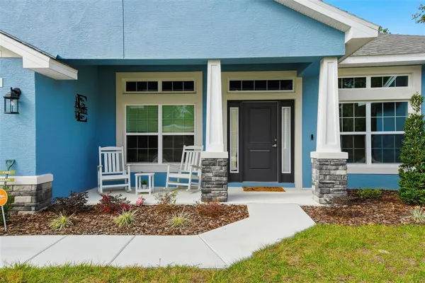 a kitchen with stainless steel appliances a sink stove refrigerator and cabinets