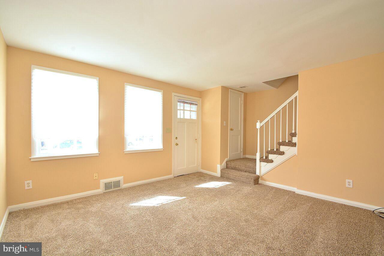 19 Cardinal Road Essex, MD 21221 - Photo 4 of 23 a view of an empty room with a window