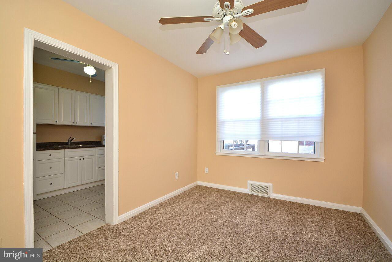 19 Cardinal Road Essex, MD 21221 - Photo 8 of 23 a view of an empty room with a window