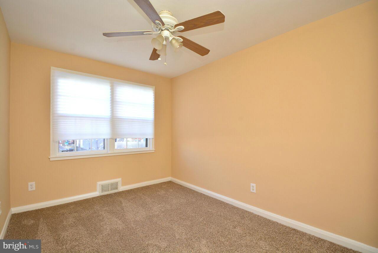19 Cardinal Road Essex, MD 21221 - Photo 9 of 23 an empty room with a window