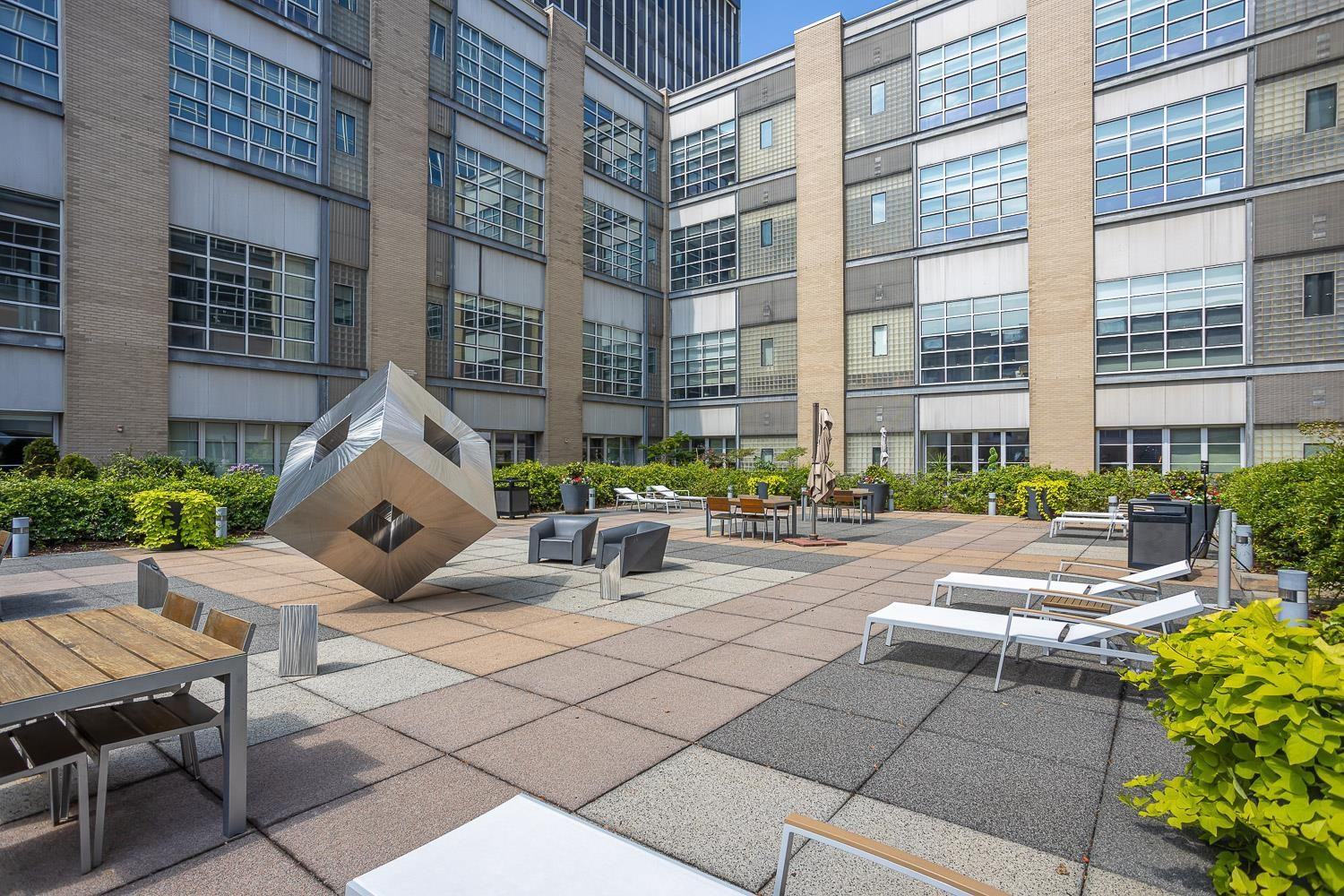 319 Fayetteville Street, Unit 209 Raleigh, NC 27601 - Photo 25 of 32 The shared courtyard features 2 grilling areas.