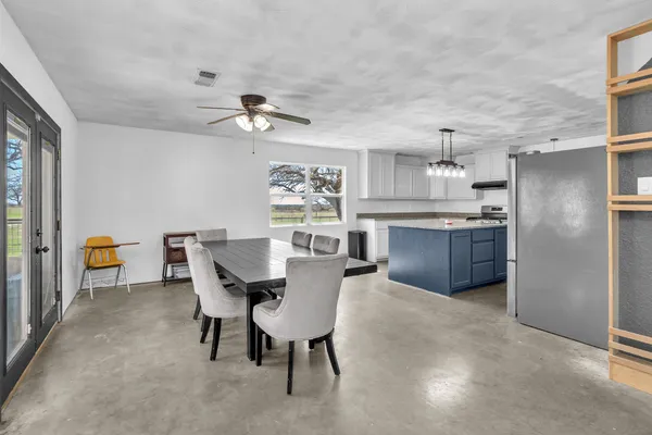a view of a kitchen and dining room