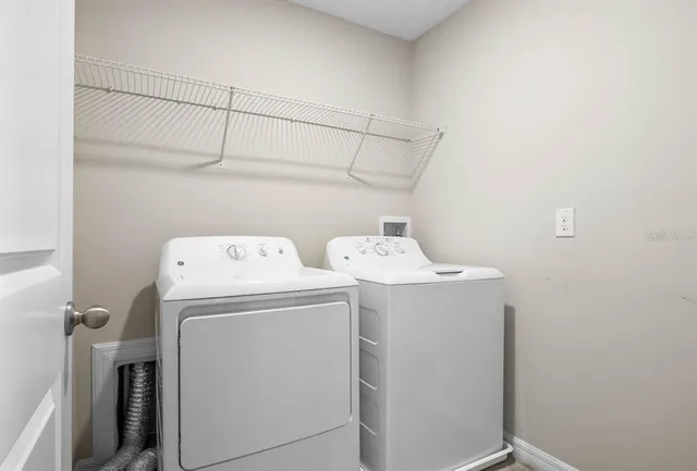 a utility room with dryer and washer