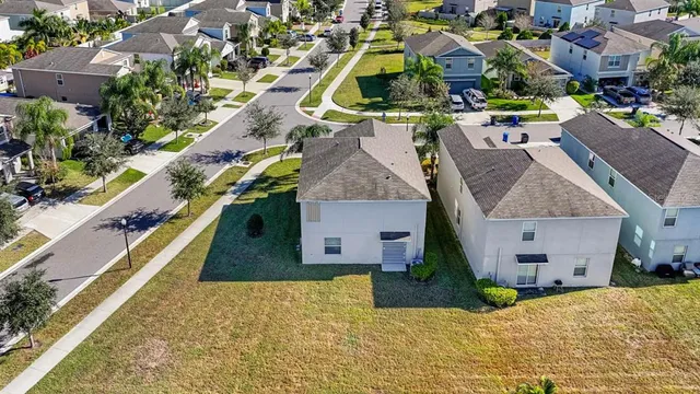 an aerial view of a house with a swimming pool