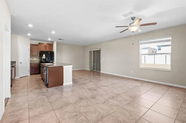 a view of a kitchen with furniture and chandelier