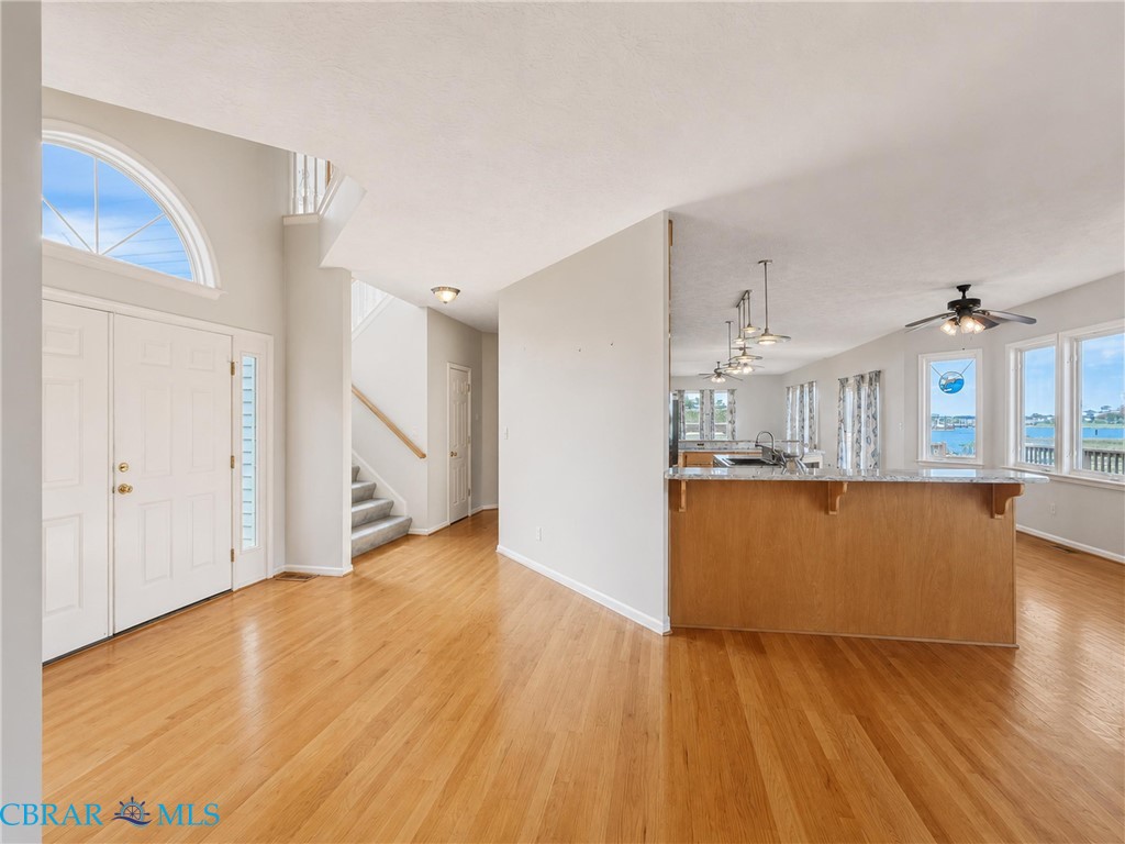 1214 Dandy Loop Road Yorktown, VA 23692 - Photo 16 of 65 a view of a kitchen with wooden floor and a kitchen