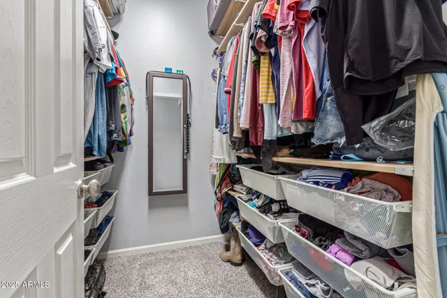 a bathroom with a double vanity sink toilet and shower