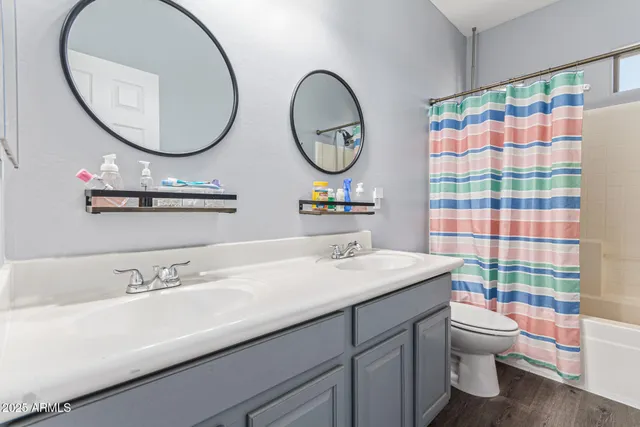 a bathroom with a bathtub and shower curtain