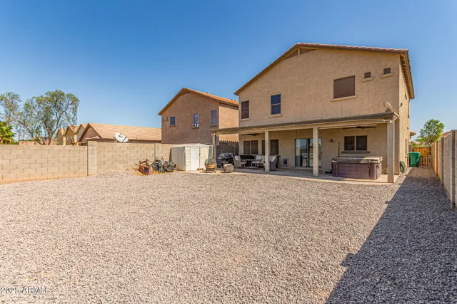 a front view of a house with yard and porch