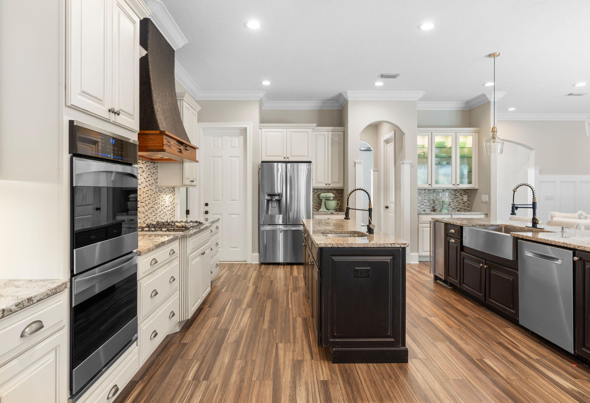 85 Garnet Place Destin, FL 32541 - Photo 16 of 50 a kitchen with stainless steel appliances sink stove refrigerator and wooden floor