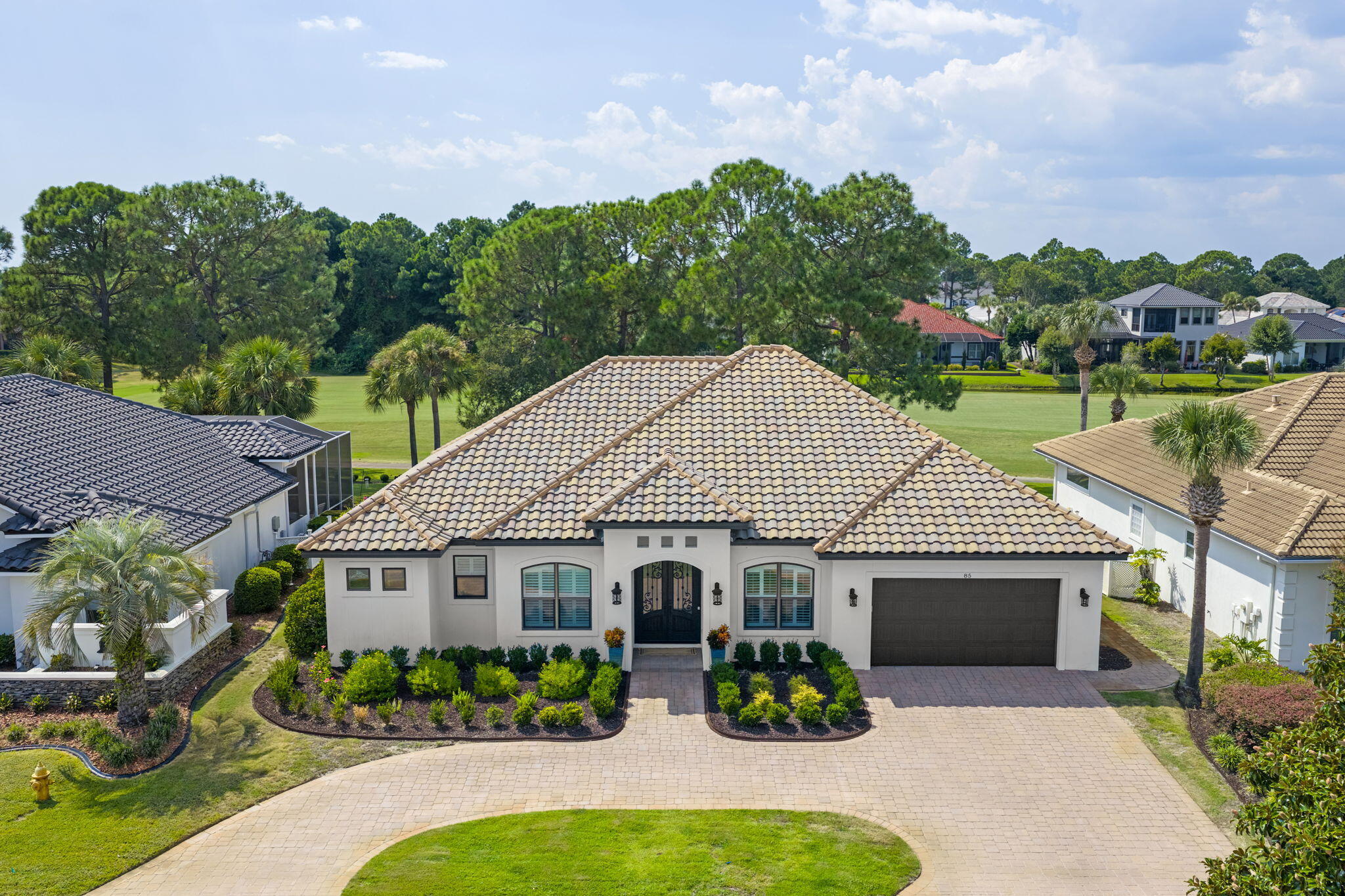 85 Garnet Place Destin, FL 32541 - Photo 2 of 50 a view of house with garden and tall tress
