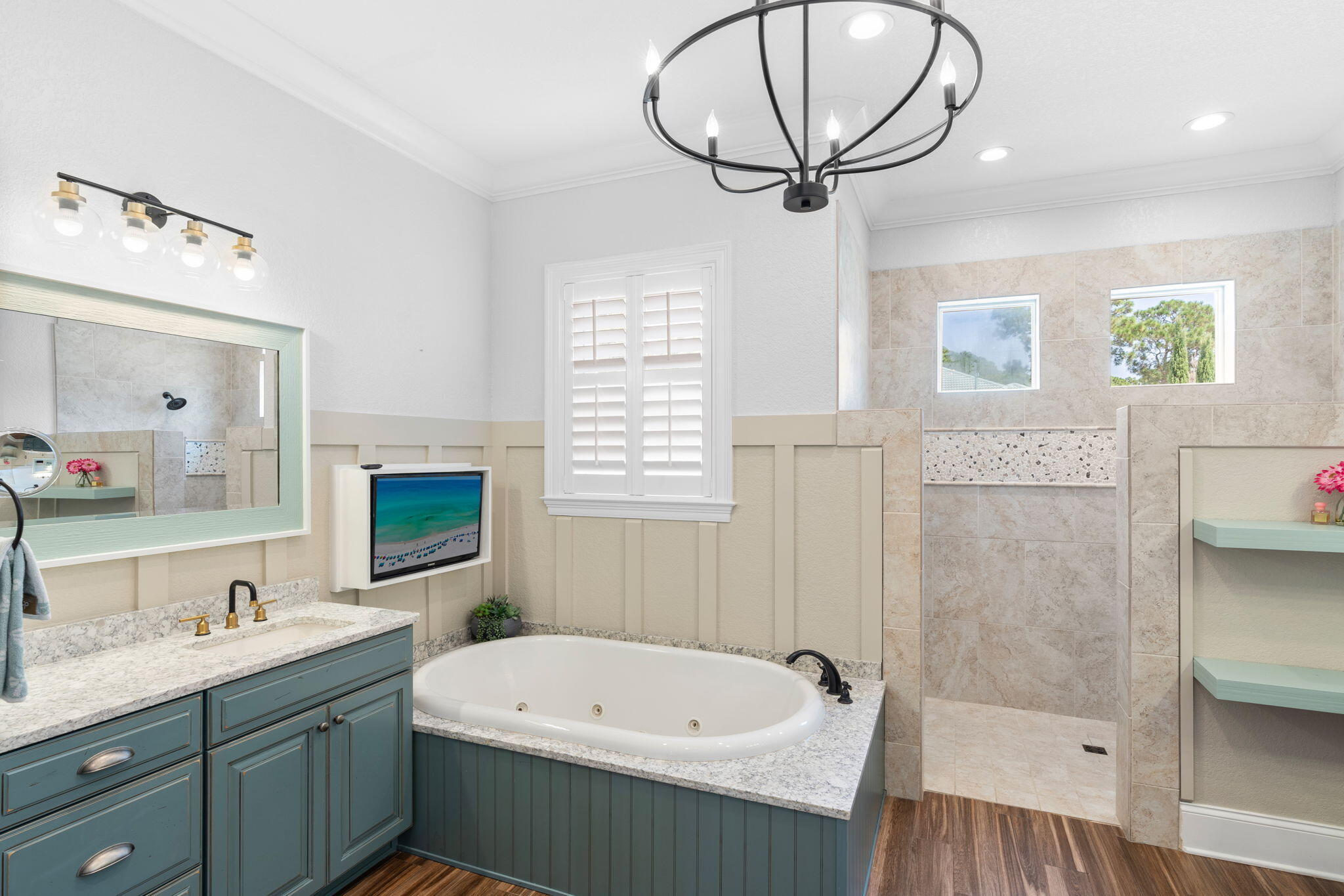 85 Garnet Place Destin, FL 32541 - Photo 22 of 50 a bathroom with a granite countertop sink a mirror and a bathtub