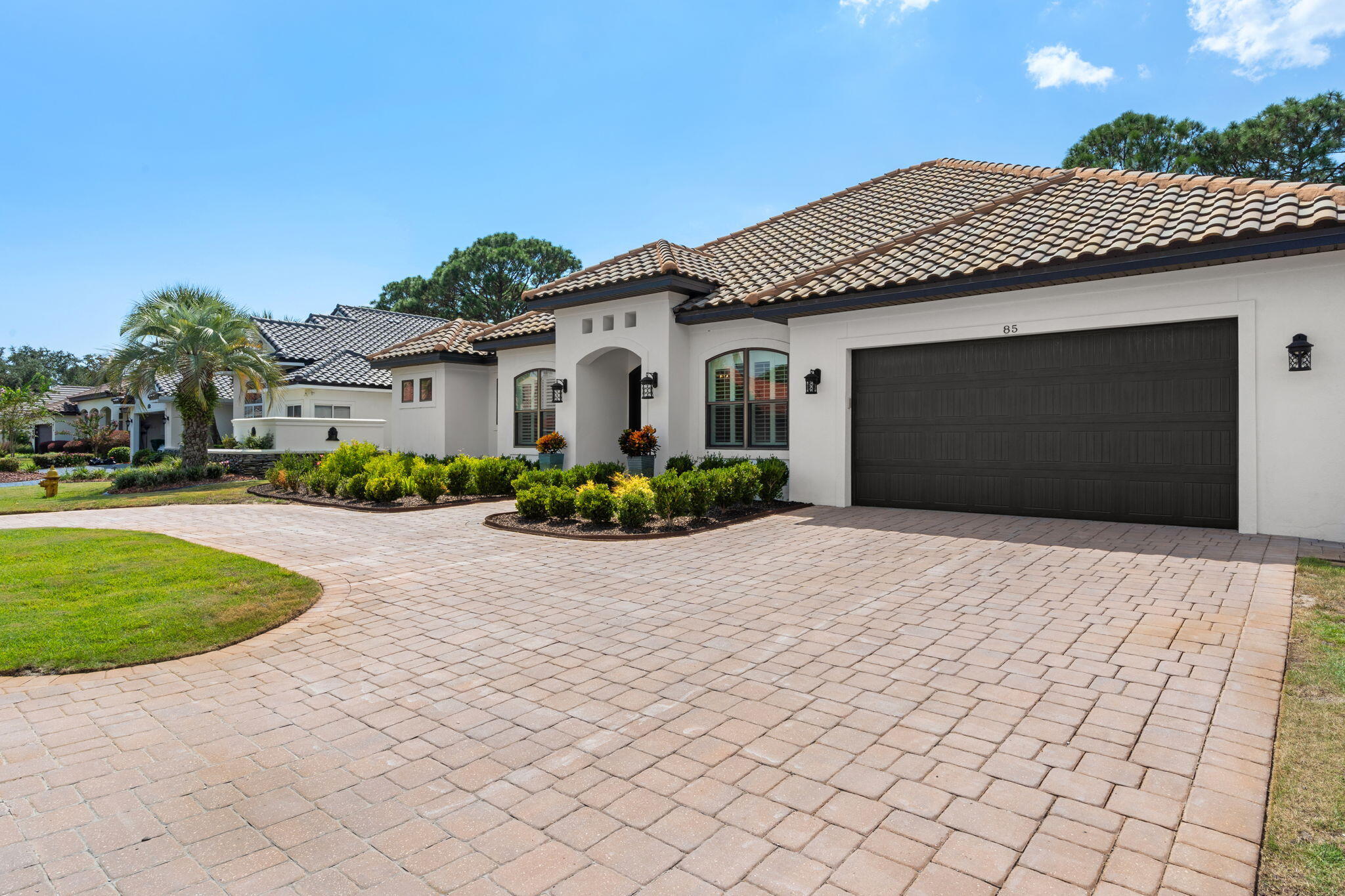 85 Garnet Place Destin, FL 32541 - Photo 3 of 50 a front view of a house with a yard and potted plants