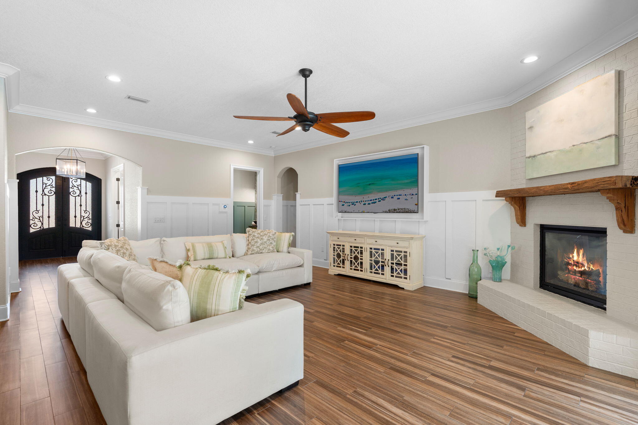 85 Garnet Place Destin, FL 32541 - Photo 9 of 50 a living room with furniture a fireplace and a flat screen tv