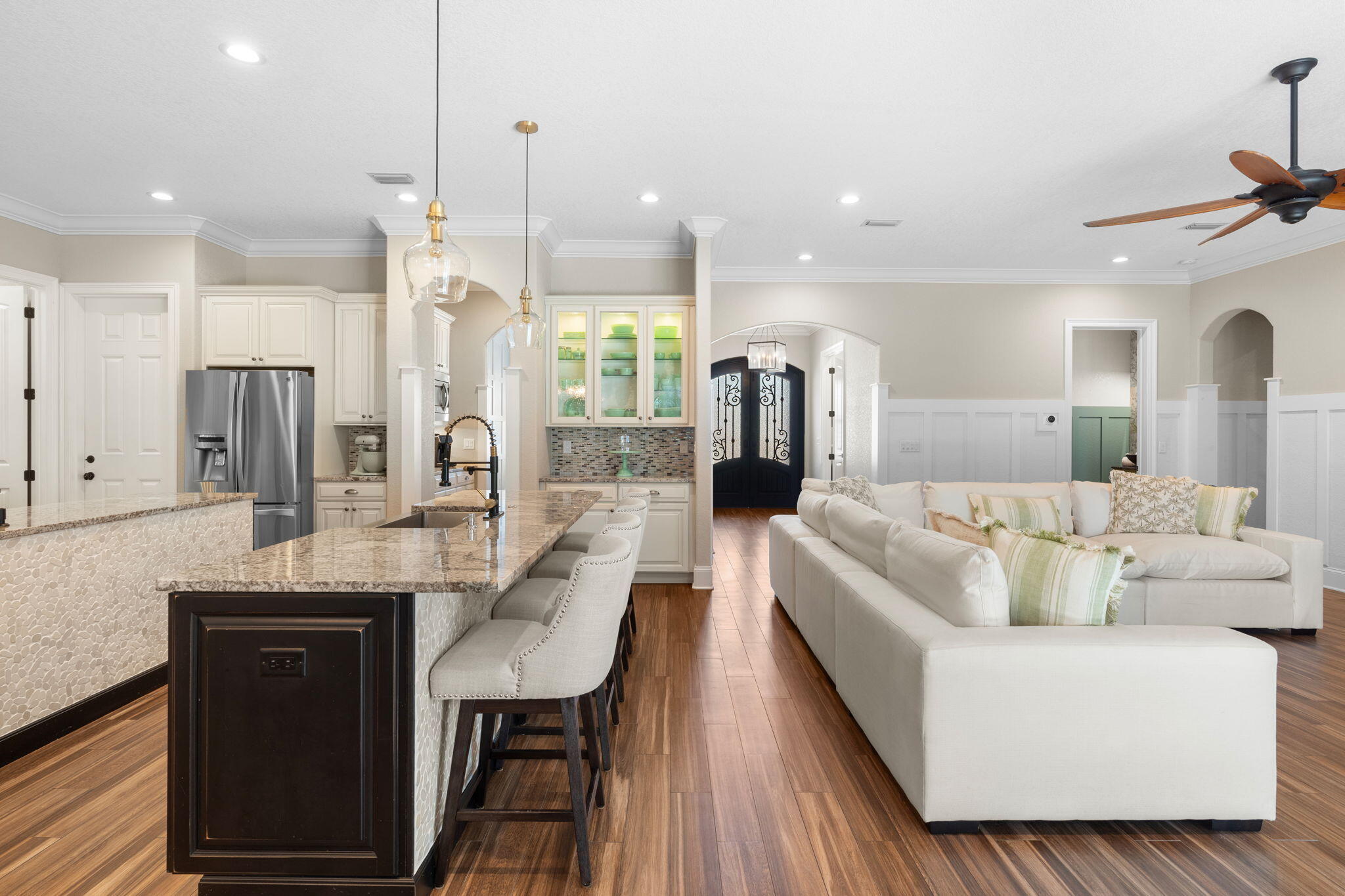 85 Garnet Place Destin, FL 32541 - Photo 10 of 50 a living room with stainless steel appliances kitchen island granite countertop furniture and a wooden floor