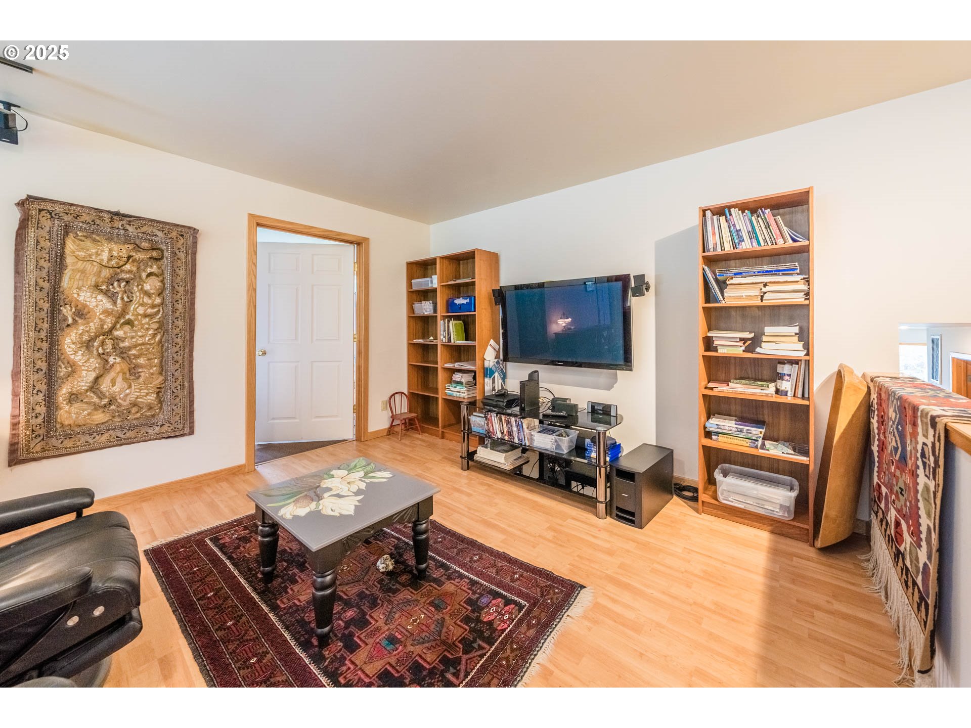 117 Southwest 66th South Beach, OR 97366 - Photo 21 of 40 a living room with furniture and a flat screen tv