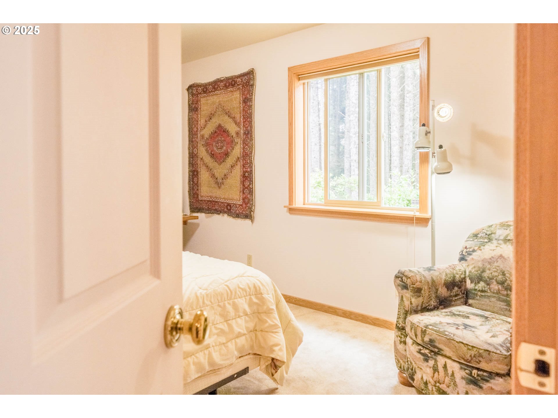 117 Southwest 66th South Beach, OR 97366 - Photo 22 of 40 a view of a bedroom with wooden floor and a window