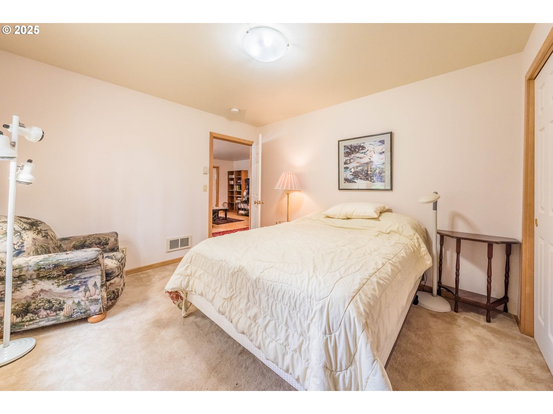 117 Southwest 66th South Beach, OR 97366 - Photo 23 of 40 a spacious bedroom with a bed and a couch