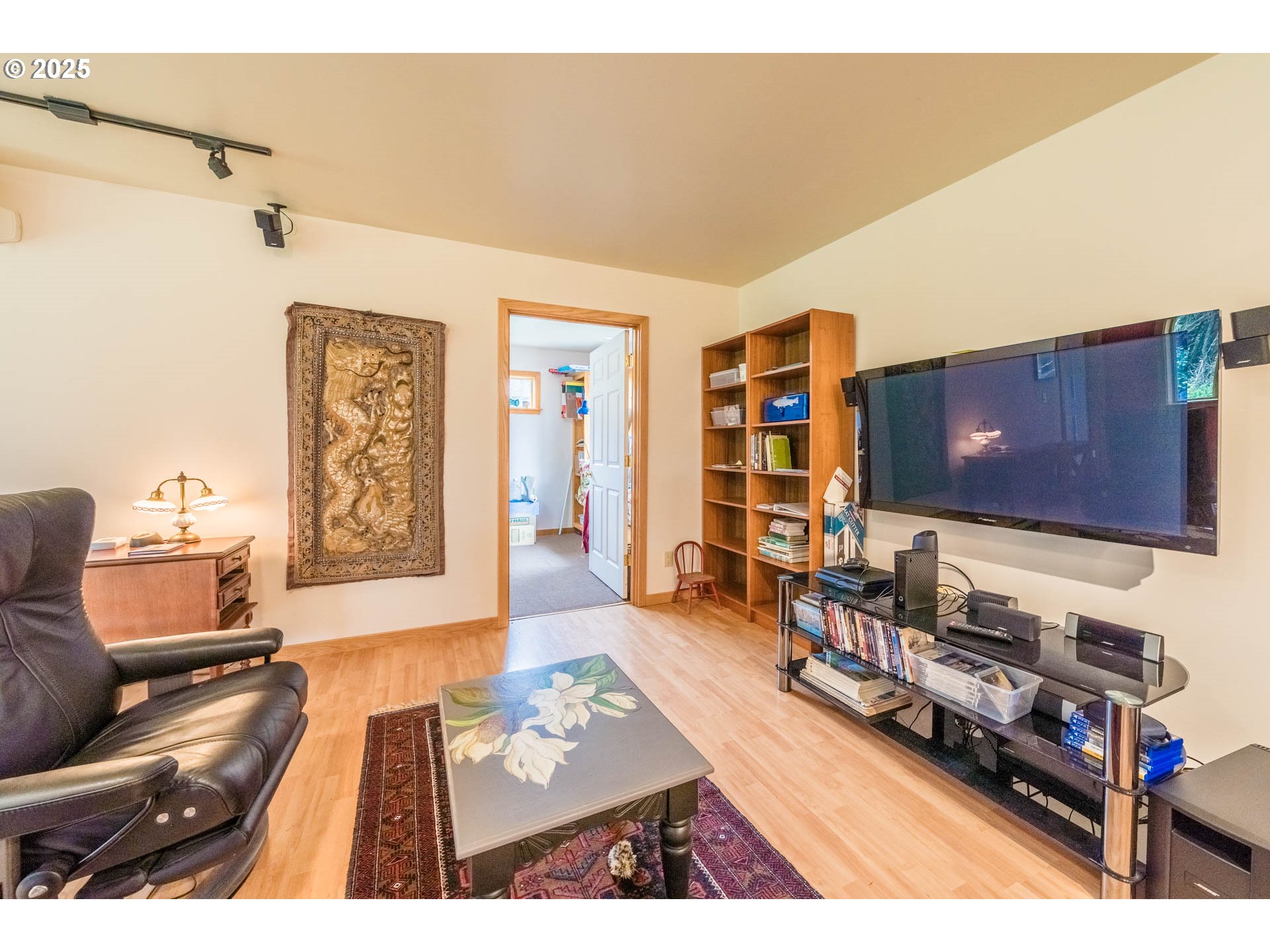 117 Southwest 66th South Beach, OR 97366 - Photo 25 of 40 a living room with furniture and a flat screen tv