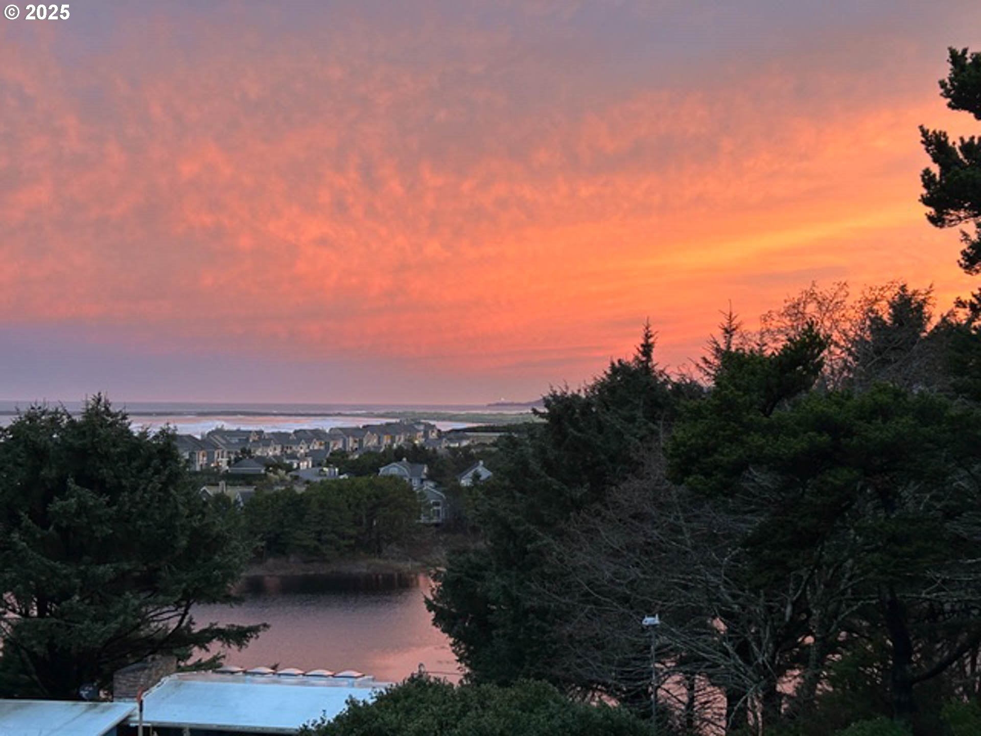 117 Southwest 66th South Beach, OR 97366 - Photo 3 of 40 a view of a lake with a mountain in the background