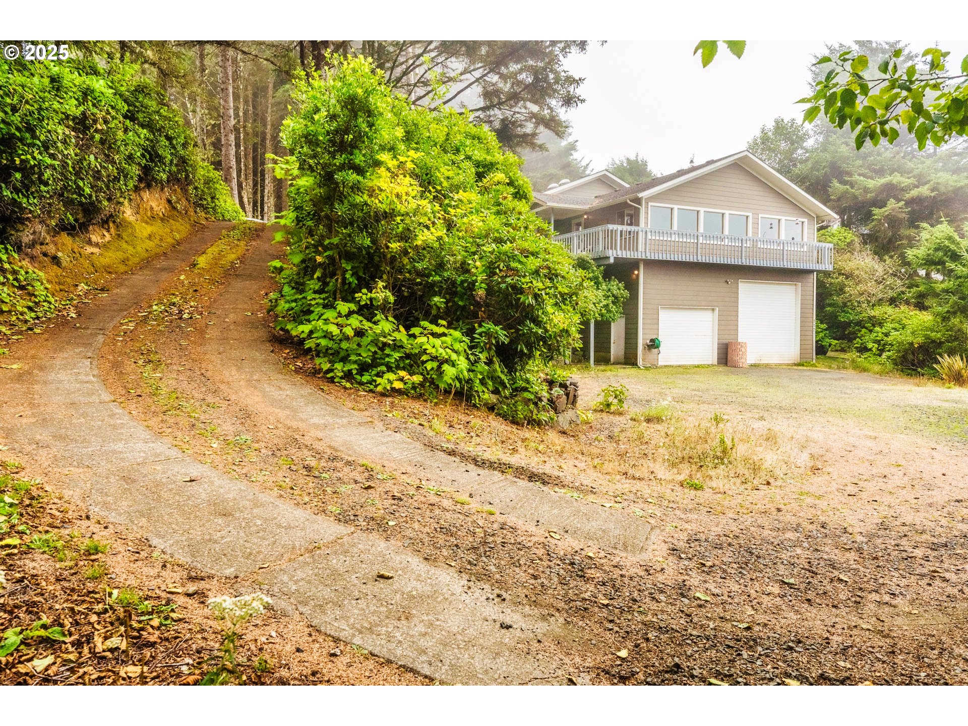 117 Southwest 66th South Beach, OR 97366 - Photo 31 of 40 a front view of a house with a yard and garage