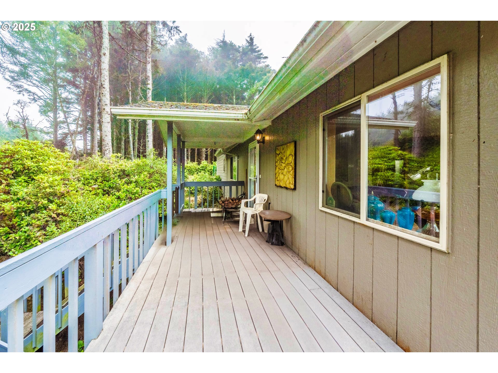117 Southwest 66th South Beach, OR 97366 - Photo 4 of 40 a view of a house with porch and wooden floor