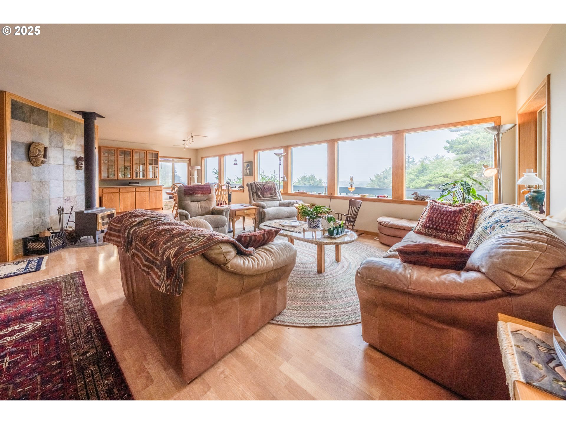 117 Southwest 66th South Beach, OR 97366 - Photo 7 of 40 a living room with furniture and a large window