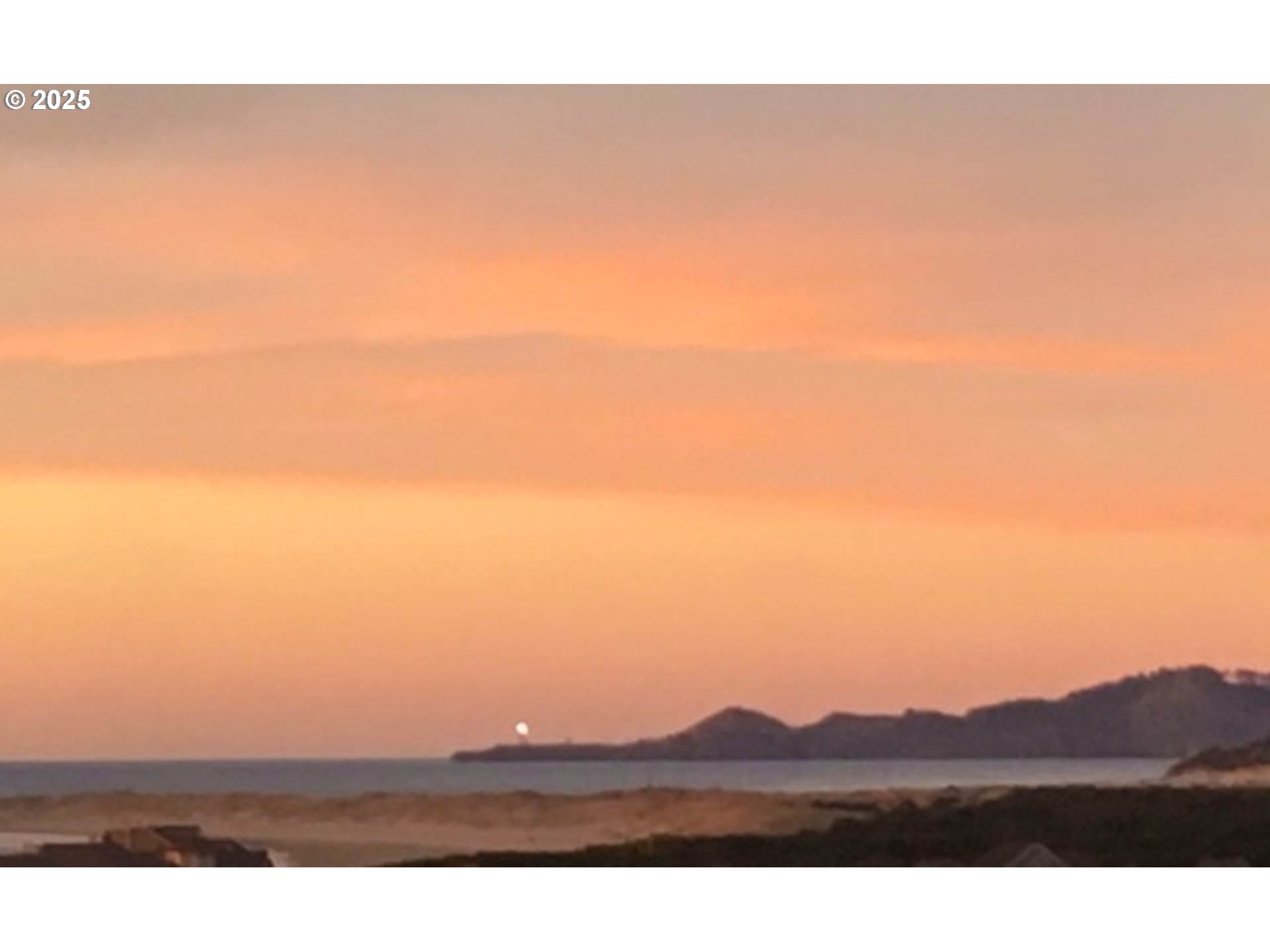 117 Southwest 66th South Beach, OR 97366 - Photo 8 of 40 a view of mountain with sunset in background