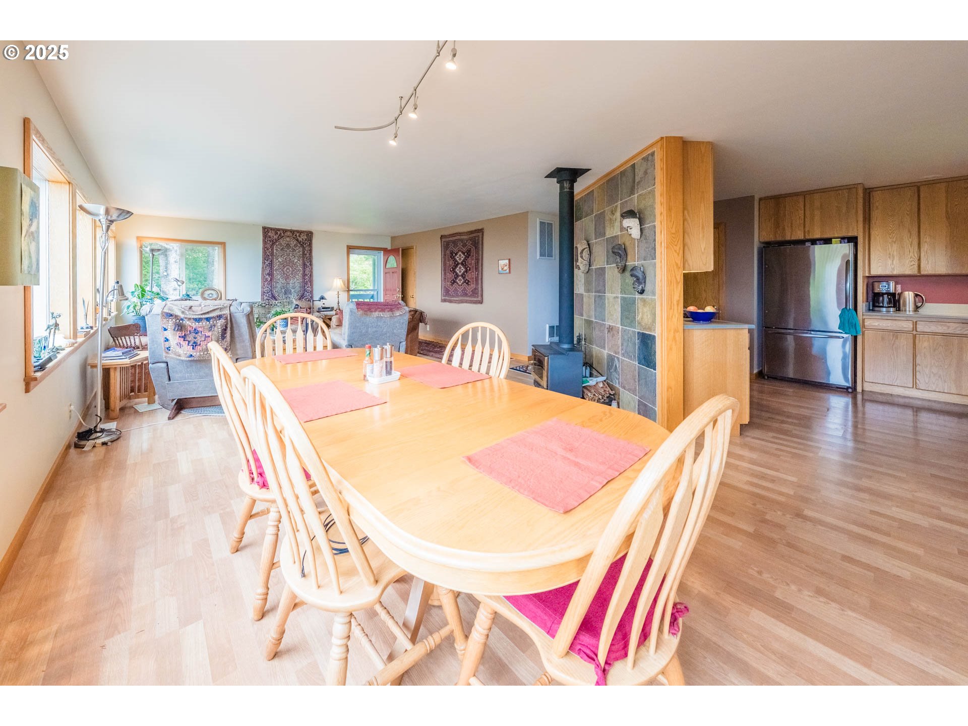 117 Southwest 66th South Beach, OR 97366 - Photo 9 of 40 a dining room with furniture and wooden floor