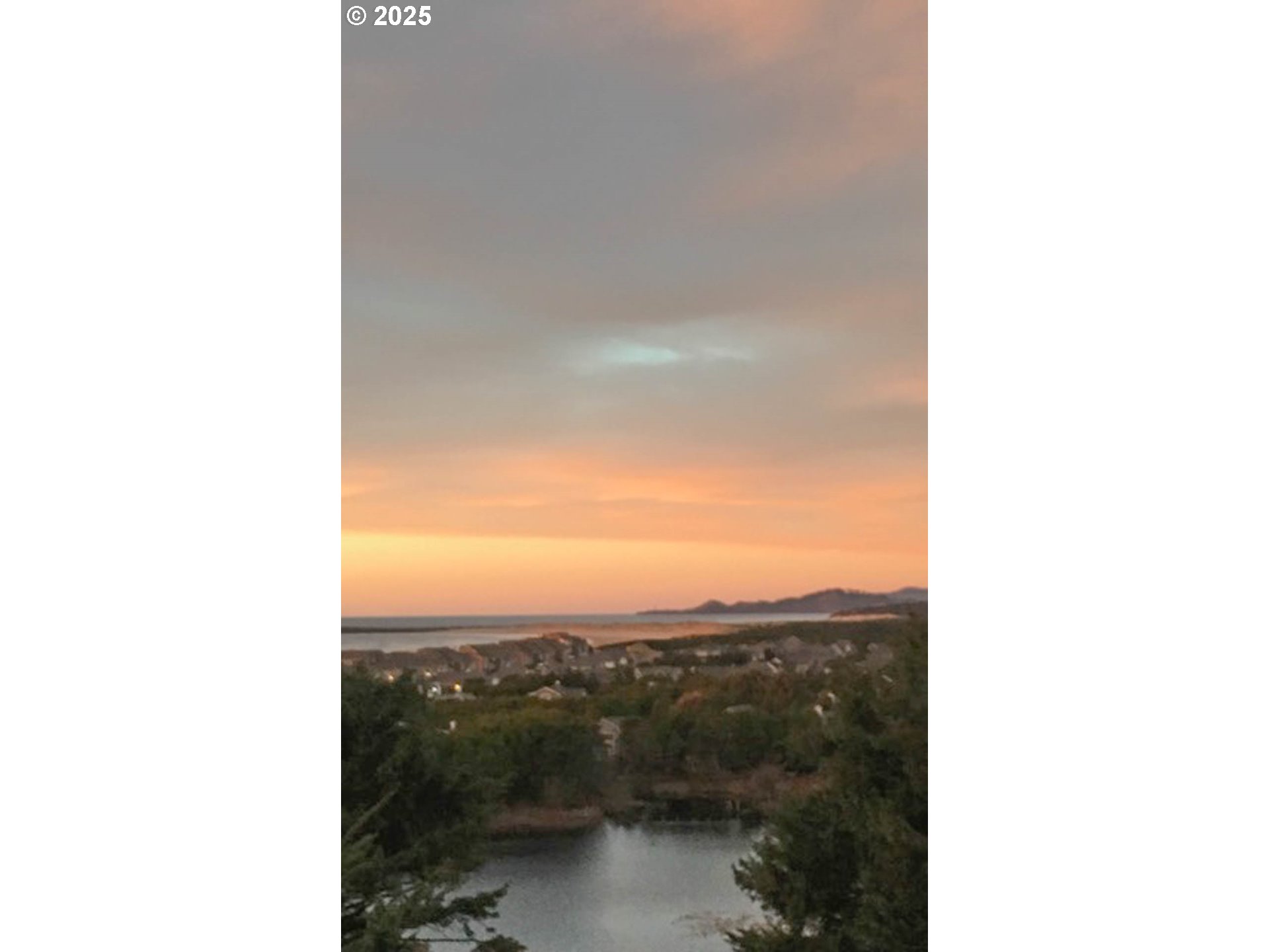 117 Southwest 66th South Beach, OR 97366 - Photo 10 of 40 a view of a lake and mountain