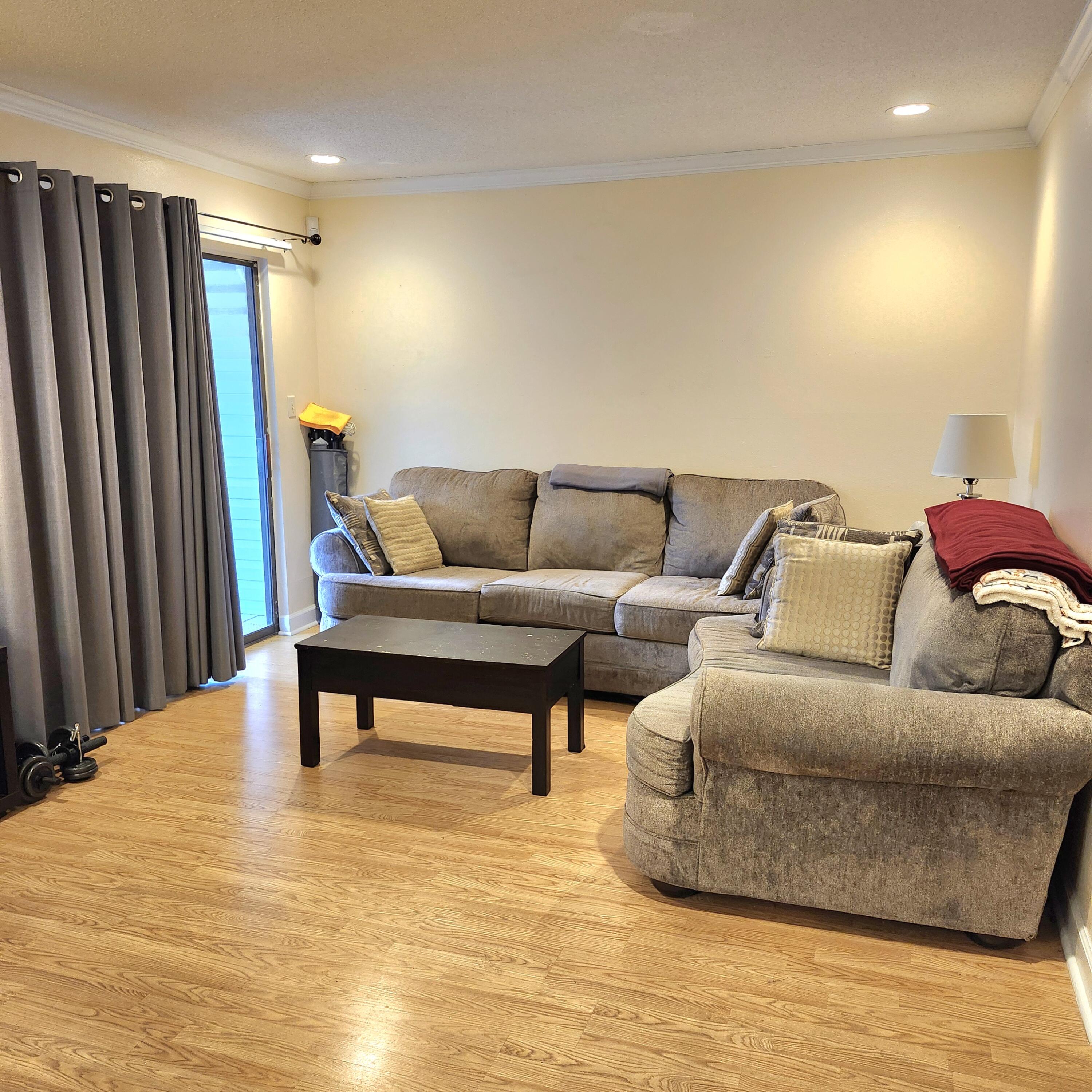 101 Old Ferry Road, Unit 8D Shalimar, FL 32579 - Photo 3 of 21 a living room with furniture and a wooden floor