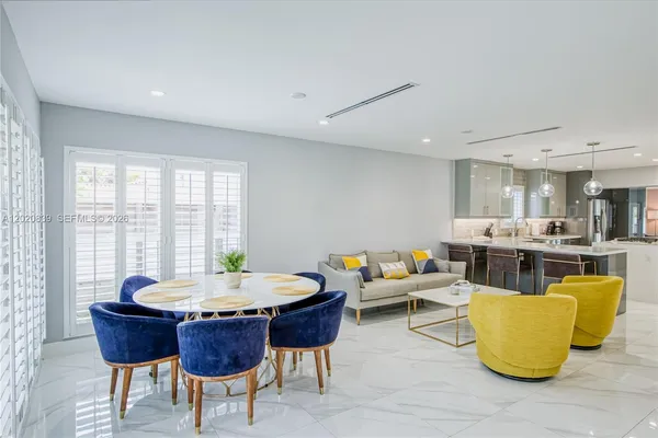 a living room with furniture and a table