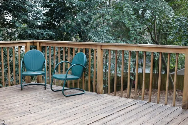 a view of deck with wooden floor and outdoor seating