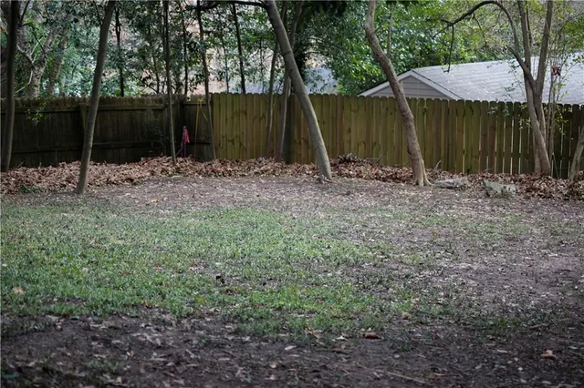 a backyard of a house with lots of green space