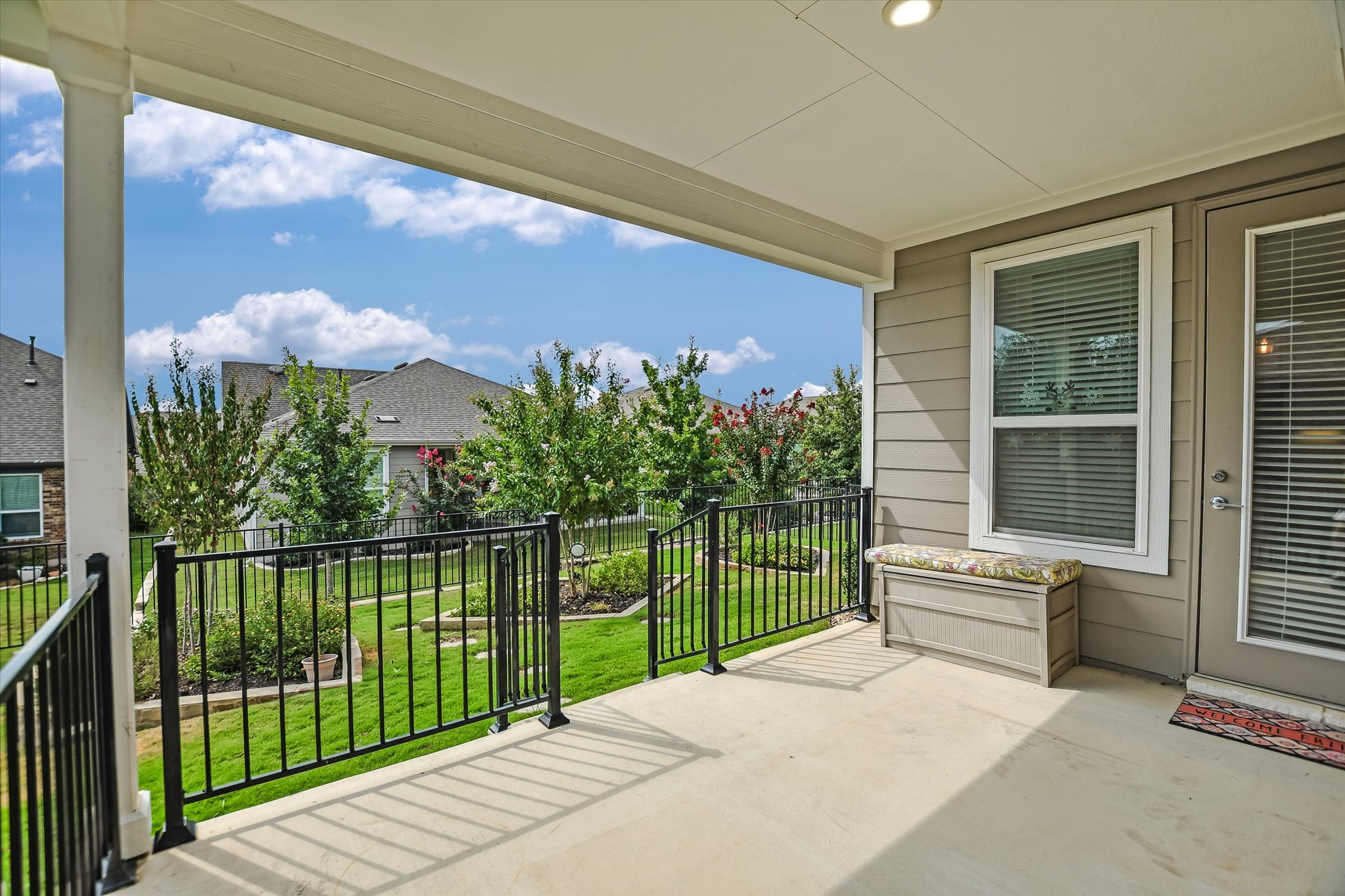 702 Kitty Hawk Road Georgetown, TX 78633 - Photo 17 of 20 a view of a house with a floor to ceiling window and a small yard
