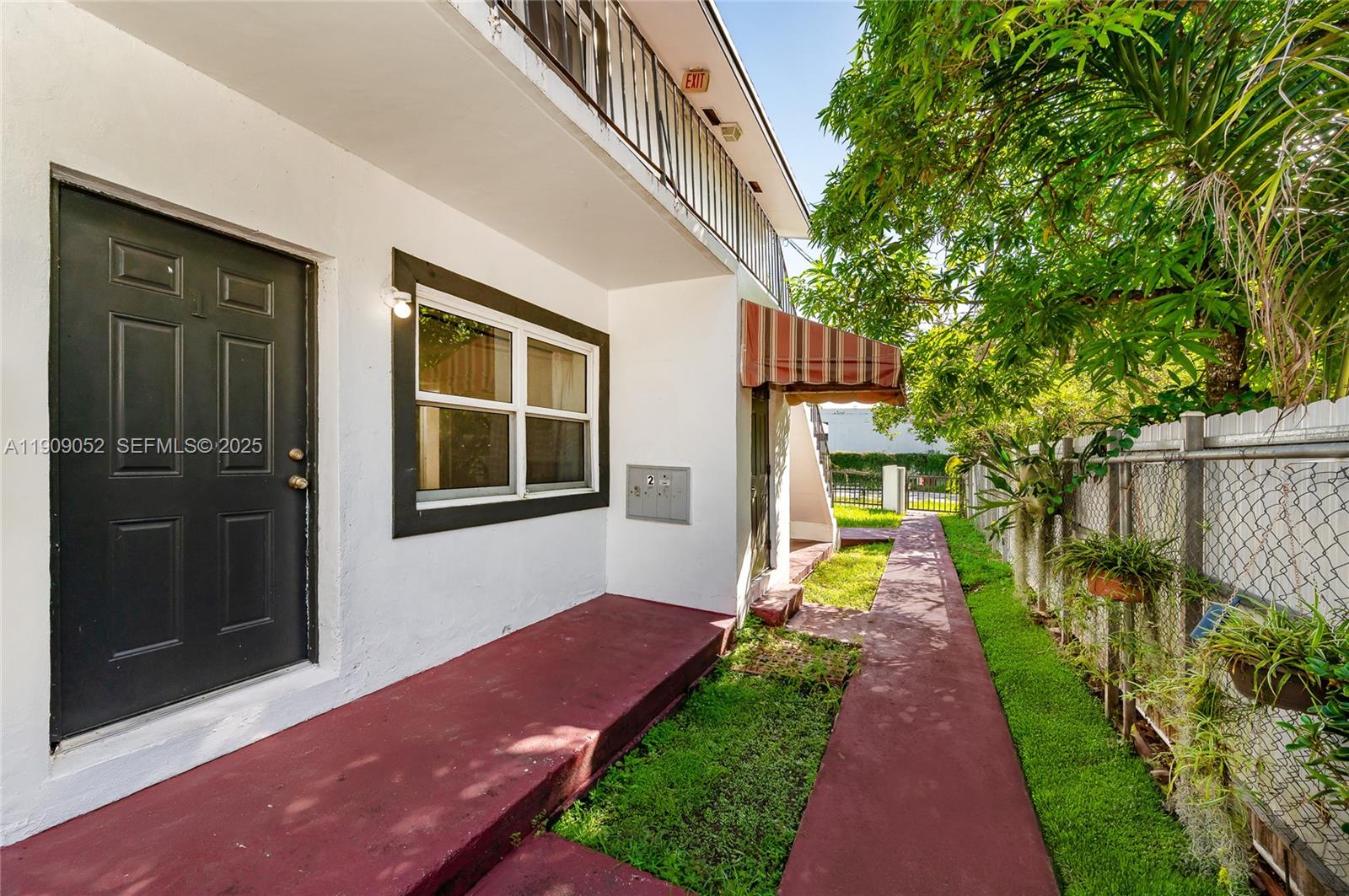 520 Southwest Krome Terrace Homestead, FL 33030 - Photo 6 of 17 a front view of a house with a yard