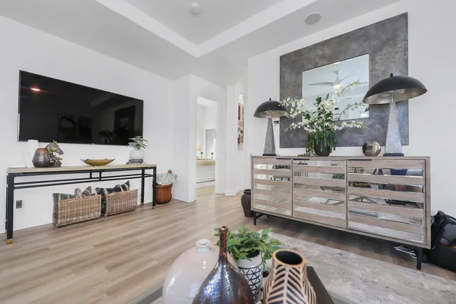 front view of house with potted plants