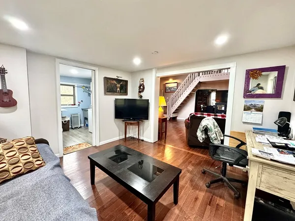 a utility room with cabinets washer and dryer