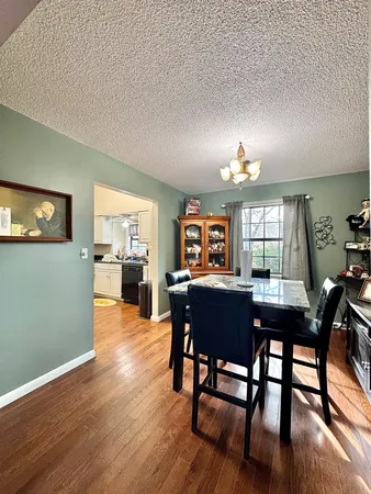 a kitchen with stainless steel appliances granite countertop a refrigerator sink and stove
