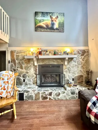 a living room with furniture or wooden floor and a window