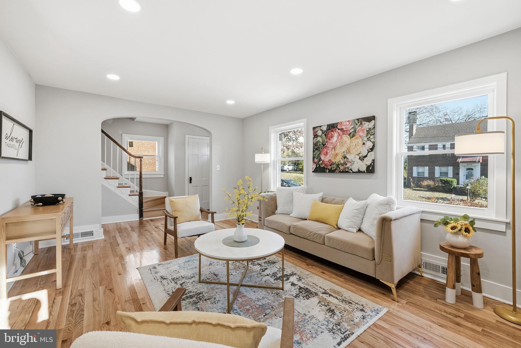 8712 Geren Road Silver Spring, MD 20901 - Photo 13 of 72 a living room with furniture and a painting on the wall