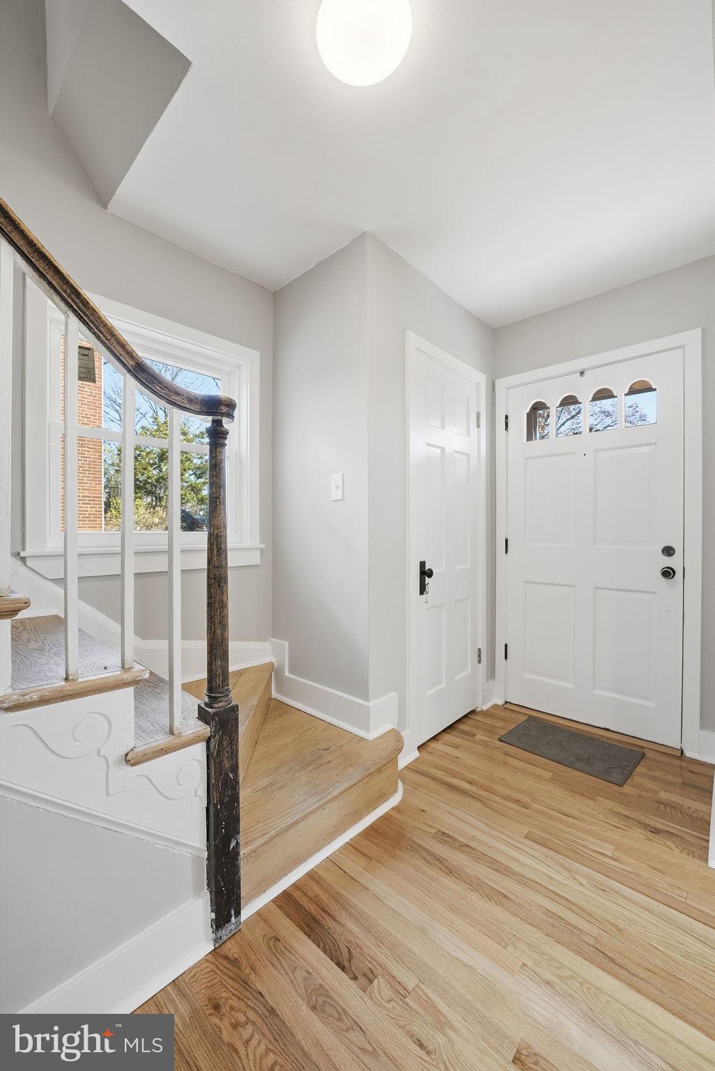 8712 Geren Road Silver Spring, MD 20901 - Photo 17 of 72 a view of a livingroom with wooden floor and a ceiling fan