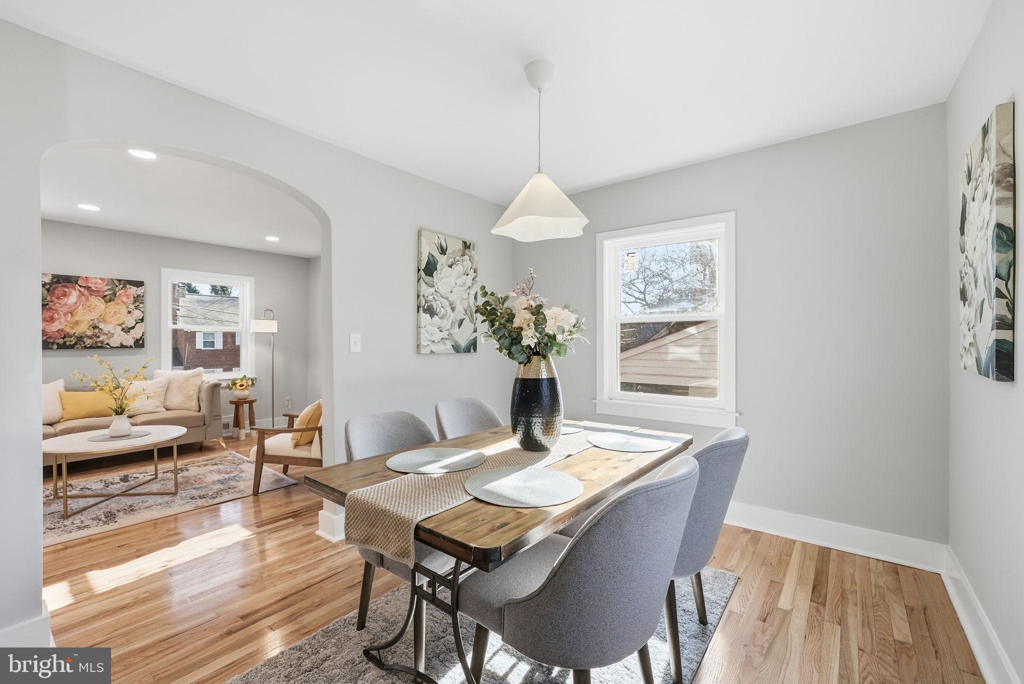 8712 Geren Road Silver Spring, MD 20901 - Photo 23 of 72 a view of a dining room with furniture window and wooden floor