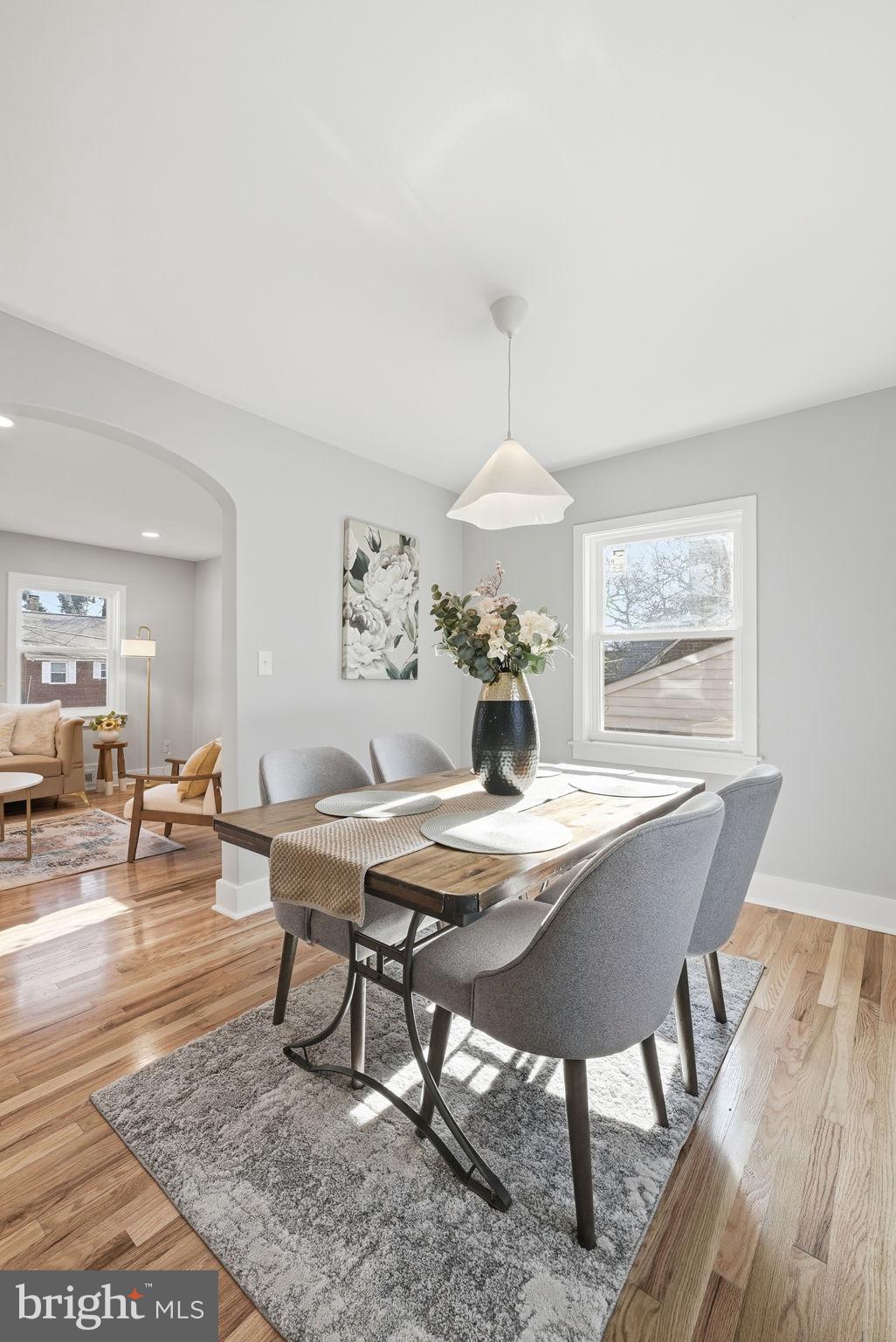 8712 Geren Road Silver Spring, MD 20901 - Photo 24 of 72 a view of a dining room with furniture wooden floor and chandelier