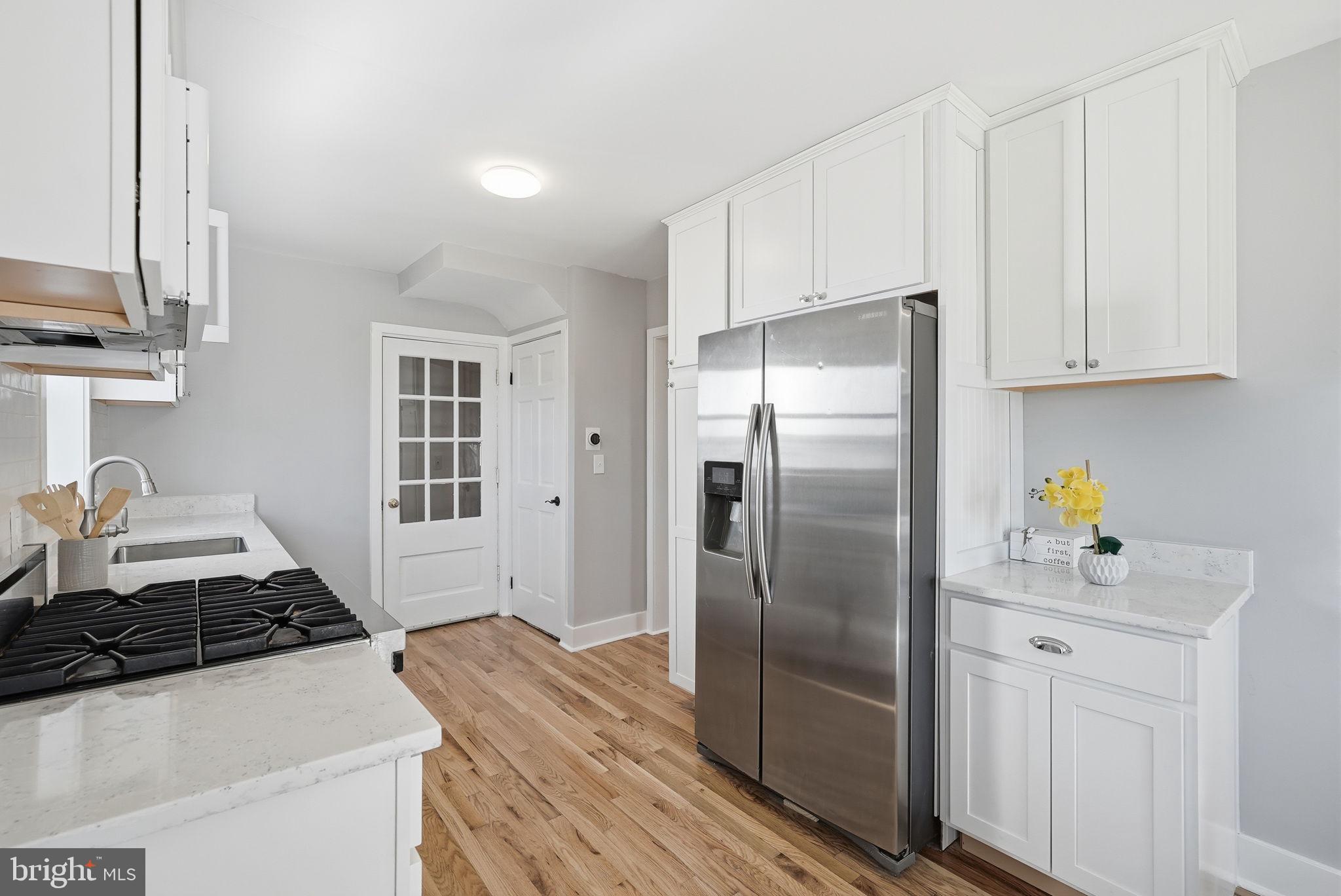 8712 Geren Road Silver Spring, MD 20901 - Photo 25 of 72 a kitchen with stainless steel appliances granite countertop a refrigerator and a stove top oven
